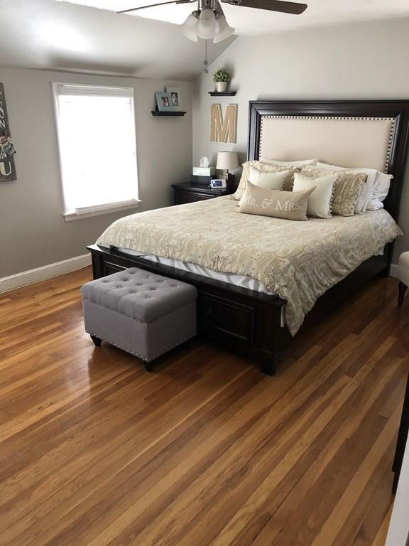 16 Mayfield Street Springfield, MA 01108 - Photo 10 of 20 a bedroom with a bed and window