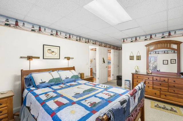 a bedroom that has a bed and a table in it