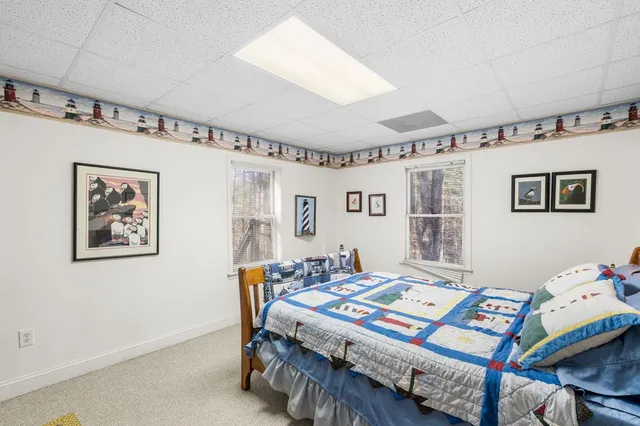 a bedroom with a bed and a table in it