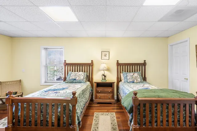 a bathroom with a sink a toilet and shower curtain