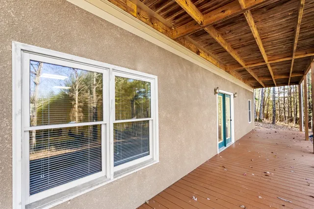 a view of a balcony with wooden floor