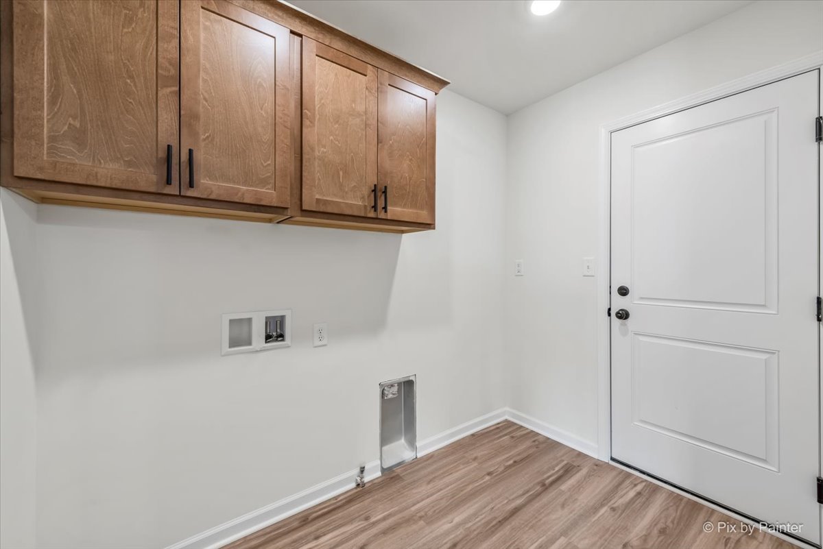 611 Apple Valley Road Harvard, IL 60033 - Photo 13 of 29 a view of storage and utility room with wooden floor