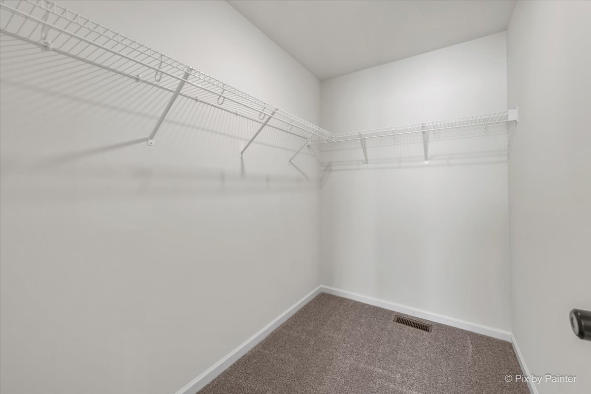 611 Apple Valley Road Harvard, IL 60033 - Photo 23 of 29 a view of a room with racks on the wall