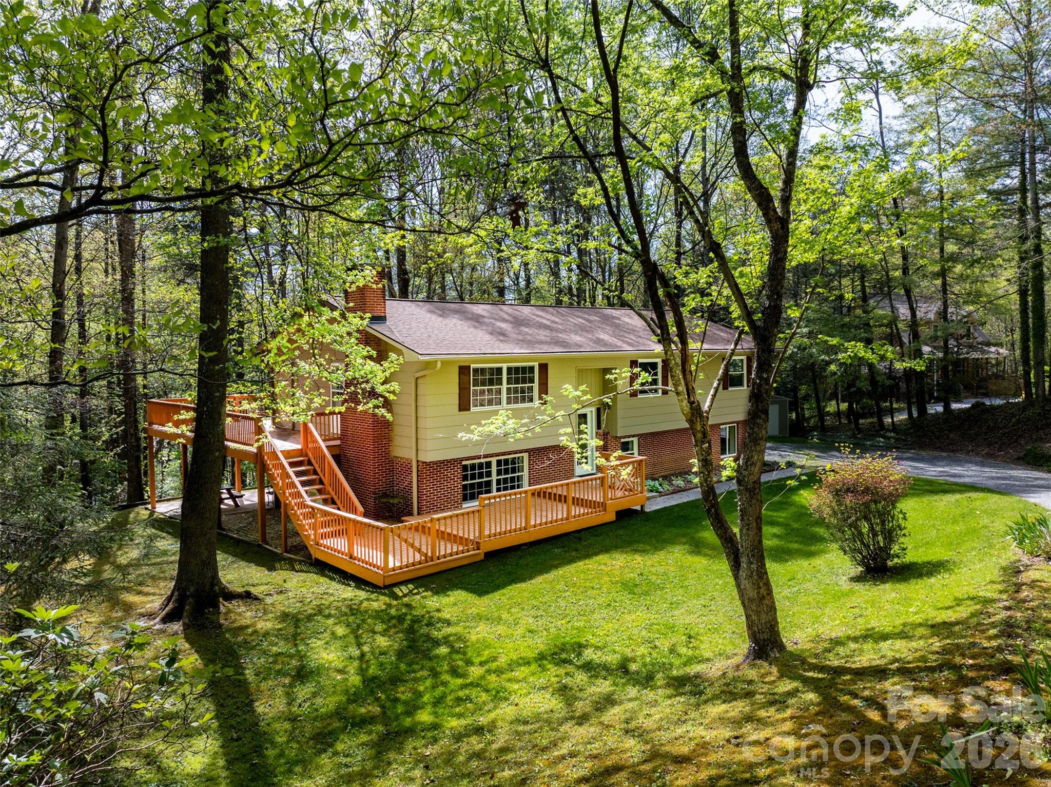 145 Jeter Mountain Road Hendersonville, NC 28739 - Photo 1 of 13 swimming pool with outdoor seating and yard