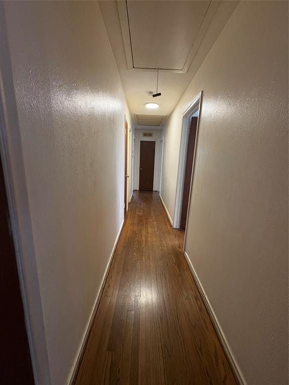 5454 Ranchero Lane Dallas, TX 75236 - Photo 12 of 24 Hardwood flooring throughout, with a flush-mounted ceiling light fixture