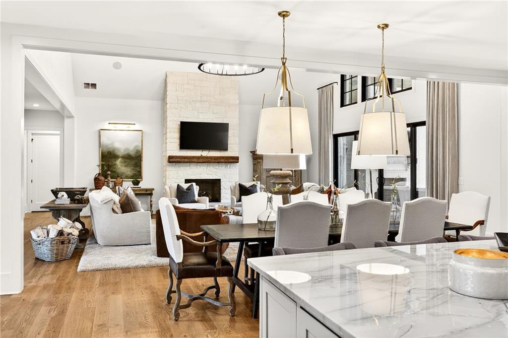 150 Fortress Way Jefferson, GA 30549 - Photo 13 of 83 a living room with furniture a fireplace and a flat screen tv
