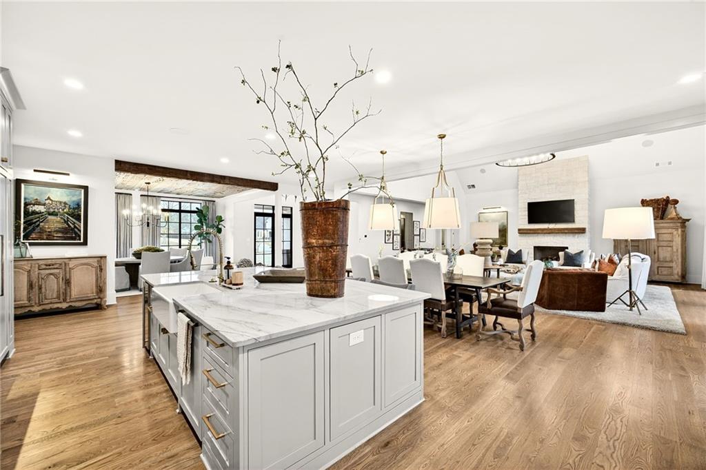 150 Fortress Way Jefferson, GA 30549 - Photo 14 of 83 a view of living room kitchen with stainless steel appliances granite countertop lots of white furniture a flat screen tv and a refrigerator
