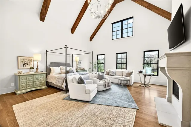 a spacious bathroom with a toilet sink and mirror