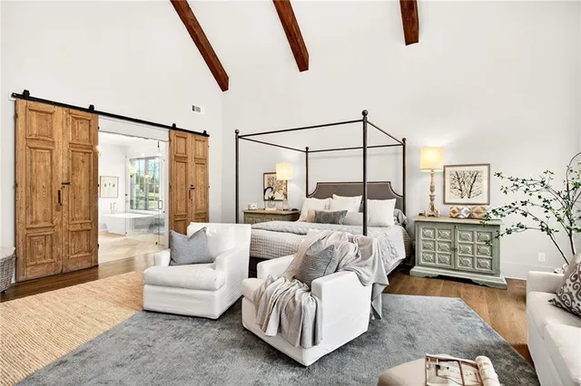 a living room with furniture and painting on the wall