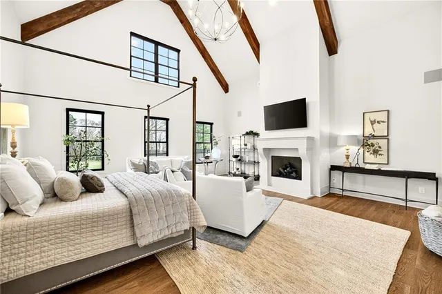 a living room with furniture a window and a chandelier
