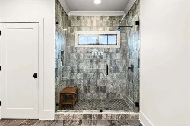 a living room with furniture a flat screen tv and a wooden floor