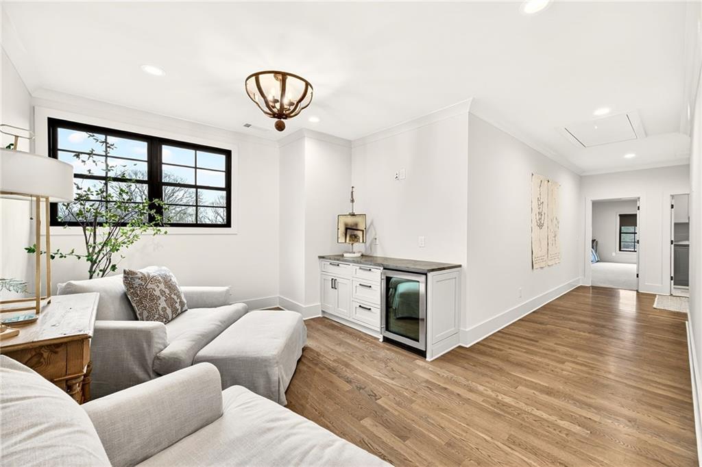 150 Fortress Way Jefferson, GA 30549 - Photo 34 of 83 a living room with furniture a window and a chandelier