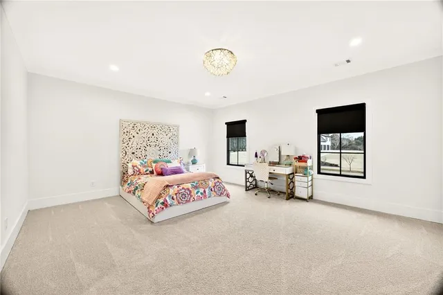 a bed room with furniture and a flat screen tv