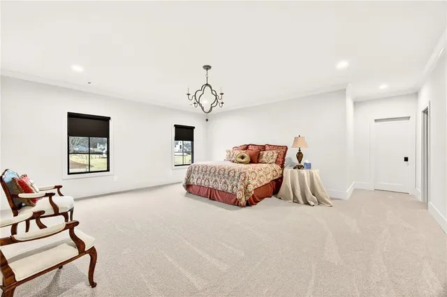 a kitchen with stainless steel appliances kitchen island granite countertop a refrigerator a oven a stove and a sink with wooden floor