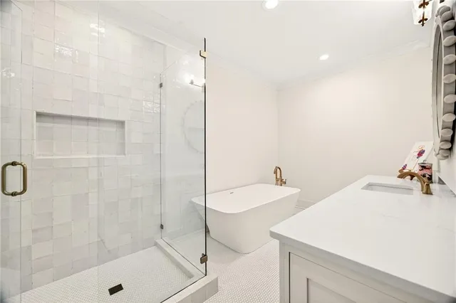 a spacious bedroom with a bed and a chandelier