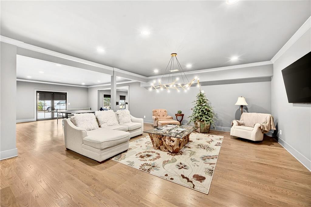 150 Fortress Way Jefferson, GA 30549 - Photo 40 of 83 a living room with furniture and a flat screen tv