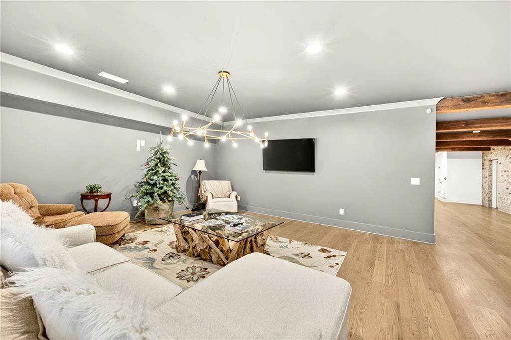150 Fortress Way Jefferson, GA 30549 - Photo 41 of 83 a living room with furniture and a flat screen tv