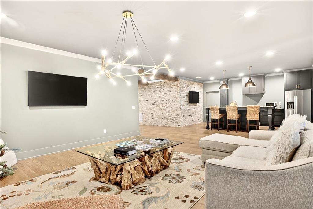 150 Fortress Way Jefferson, GA 30549 - Photo 42 of 83 a living room with furniture and a flat screen tv