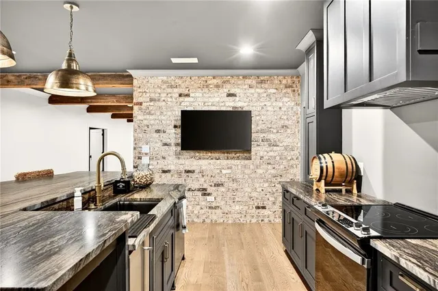 an aerial view of residential houses with swimming pool and outdoor space