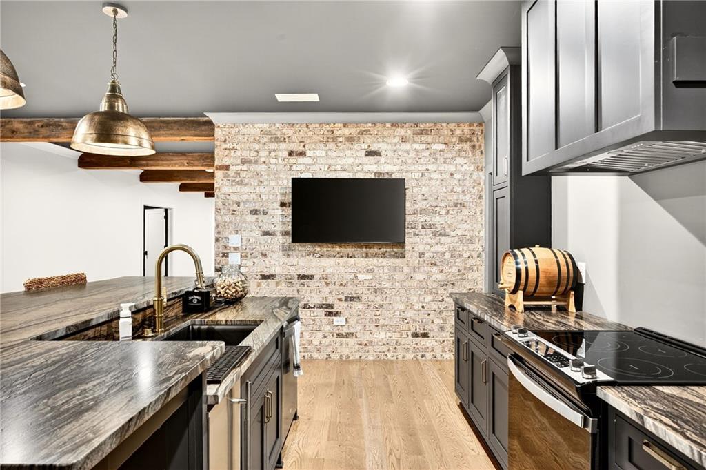 150 Fortress Way Jefferson, GA 30549 - Photo 46 of 83 a kitchen with granite countertop stainless steel appliances and a counter space