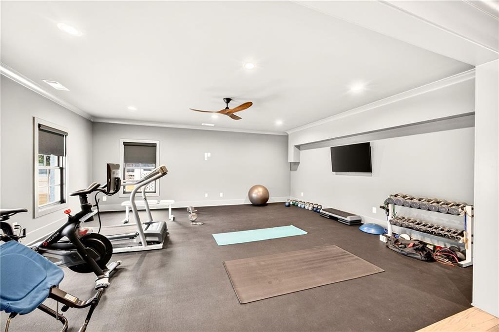 150 Fortress Way Jefferson, GA 30549 - Photo 50 of 83 a room with gym equipment and a flat screen tv