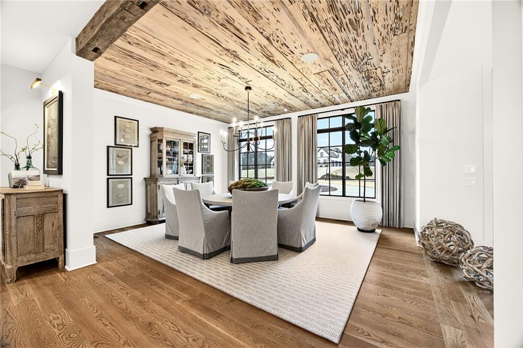 150 Fortress Way Jefferson, GA 30549 - Photo 5 of 83 a living room with furniture a wooden floor and next to a window