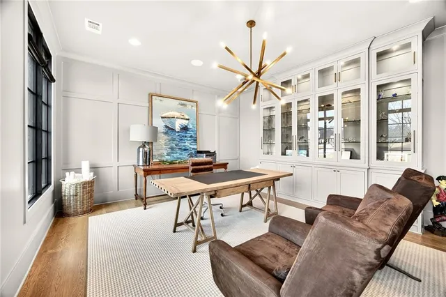 a very nice looking living room with furniture and a large window