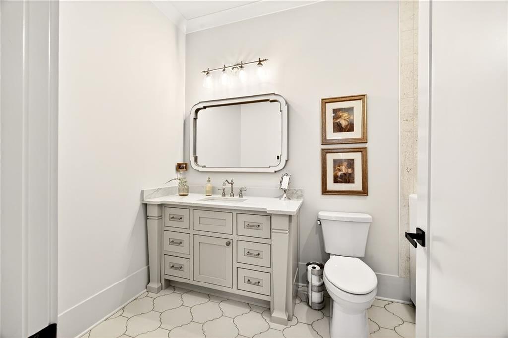 150 Fortress Way Jefferson, GA 30549 - Photo 61 of 83 a bathroom with a toilet a sink and mirror