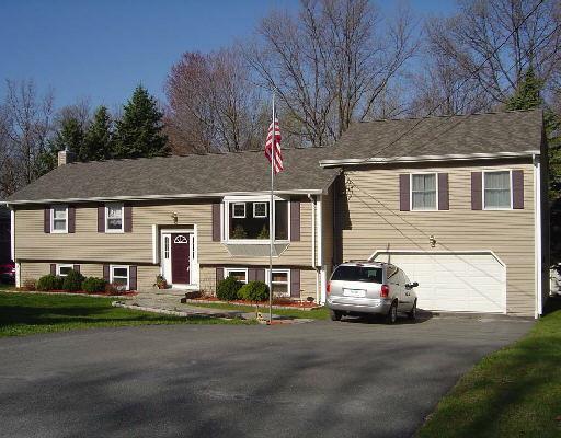 8 Manor Road New Milford, CT 06776 - Photo 1 of 1 a front view of a house with a garden