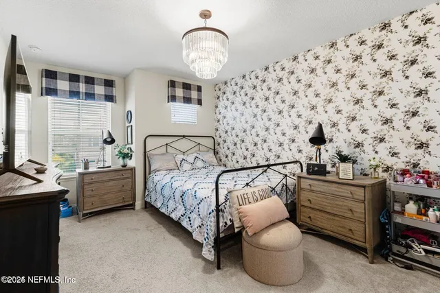 a bedroom with bed and a window