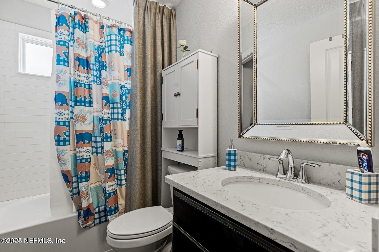 35 Clifton Bay Loop St. Johns, FL 32259 - Photo 14 of 24 a bathroom with a sink toilet vanity and shower