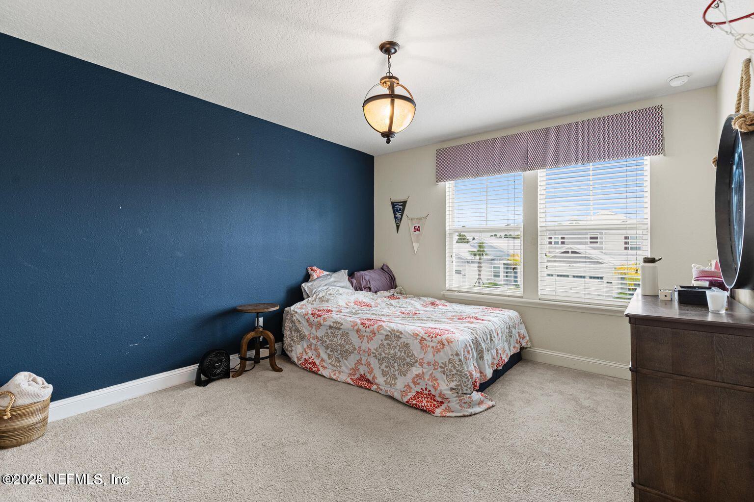 35 Clifton Bay Loop St. Johns, FL 32259 - Photo 15 of 24 a bedroom with a bed and a window