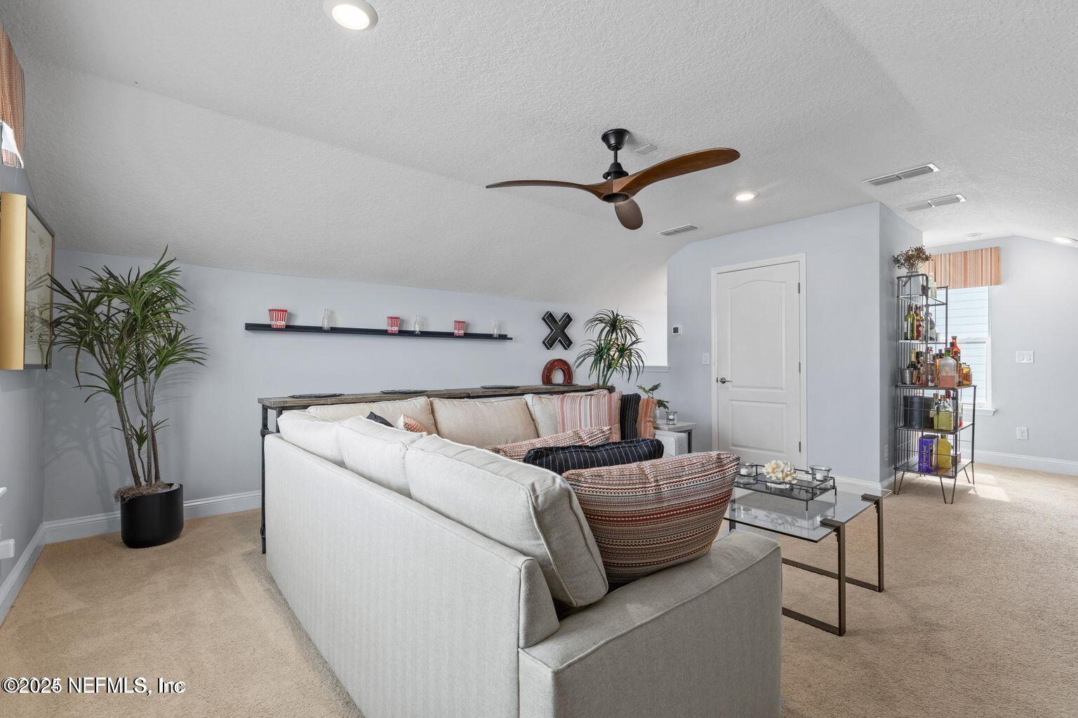 35 Clifton Bay Loop St. Johns, FL 32259 - Photo 20 of 24 a living room with furniture and potted plant