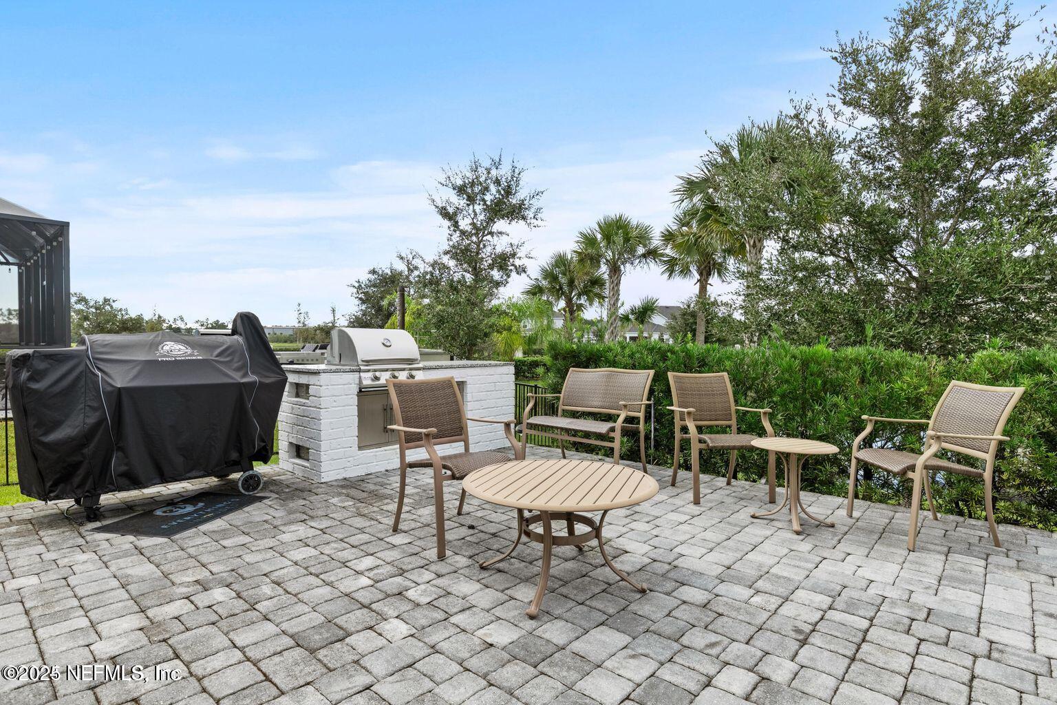 35 Clifton Bay Loop St. Johns, FL 32259 - Photo 22 of 24 a chairs and a table in a patio
