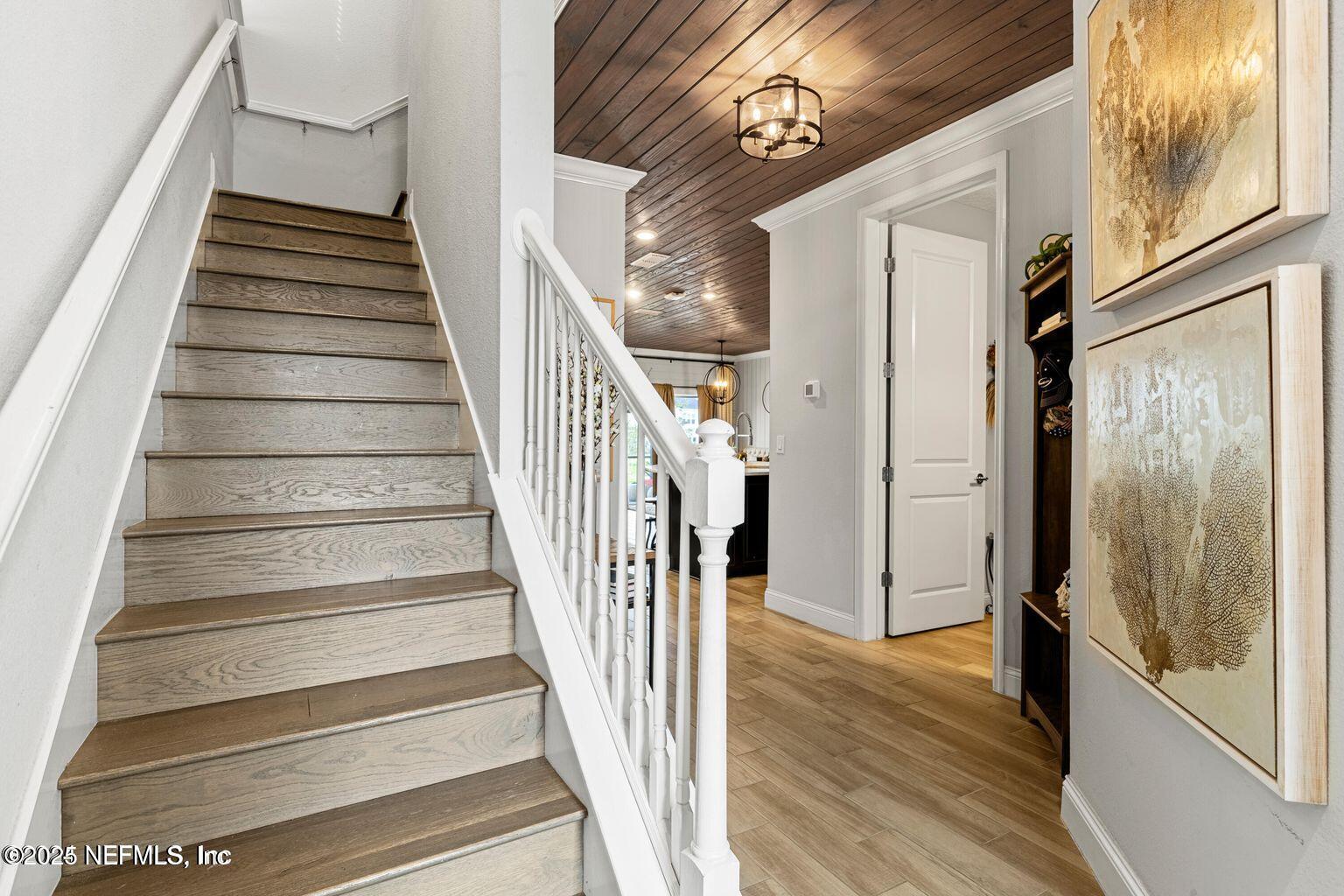 35 Clifton Bay Loop St. Johns, FL 32259 - Photo 4 of 24 a view of a hallway with wooden floor and windows