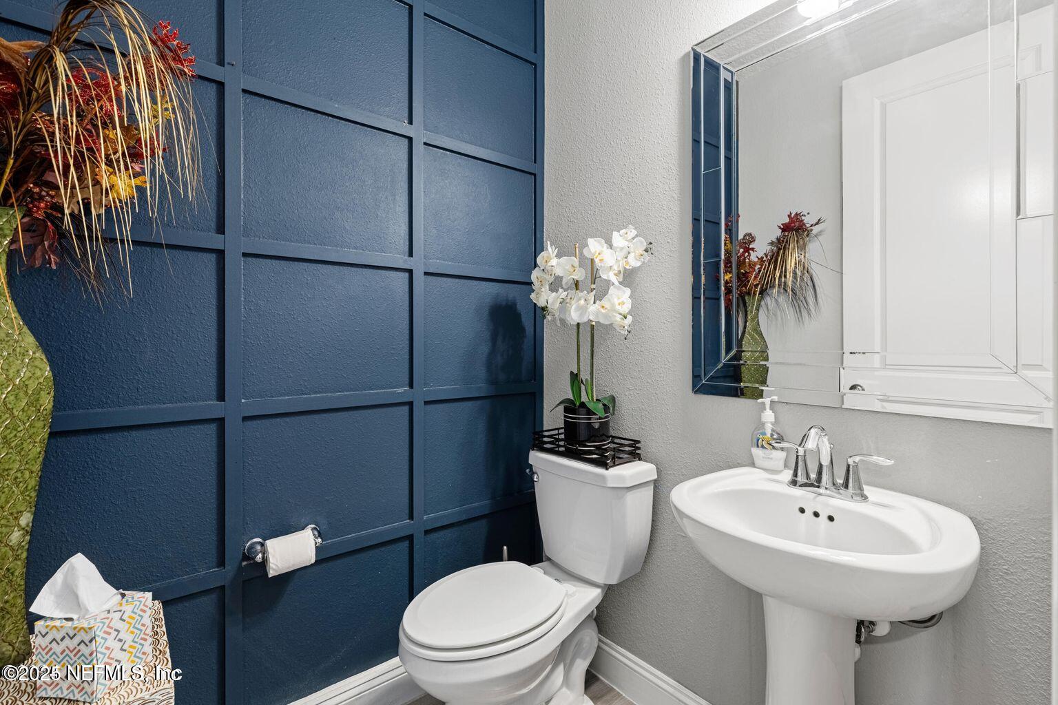 35 Clifton Bay Loop St. Johns, FL 32259 - Photo 5 of 24 a bathroom with a sink toilet and shower