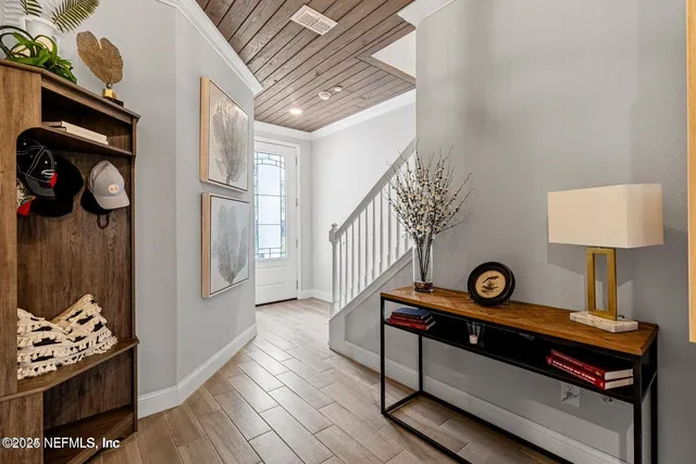 a view of room with furniture and wooden floor