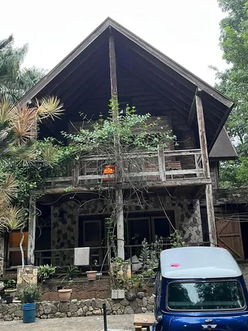 a building outdoor space with patio furniture and potted plants