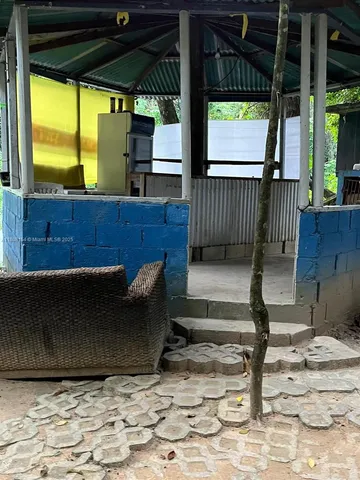 a view of a porch with furniture and a gate
