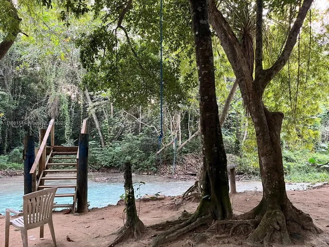 a view of a wooden deck next to a yard