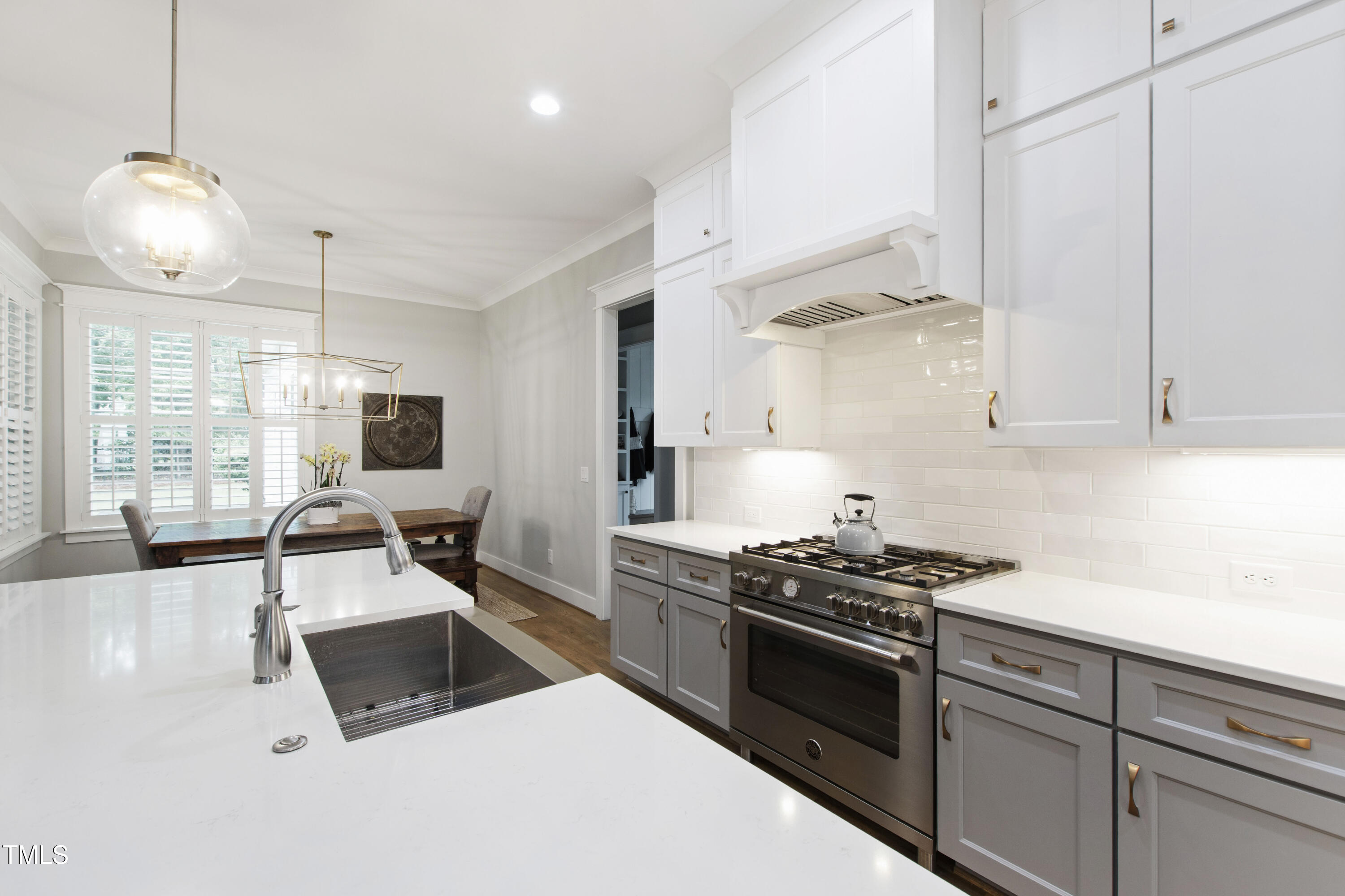 713 Brownwich Street Wake Forest, NC 27587 - Photo 17 of 78 a kitchen with white cabinets and appliances