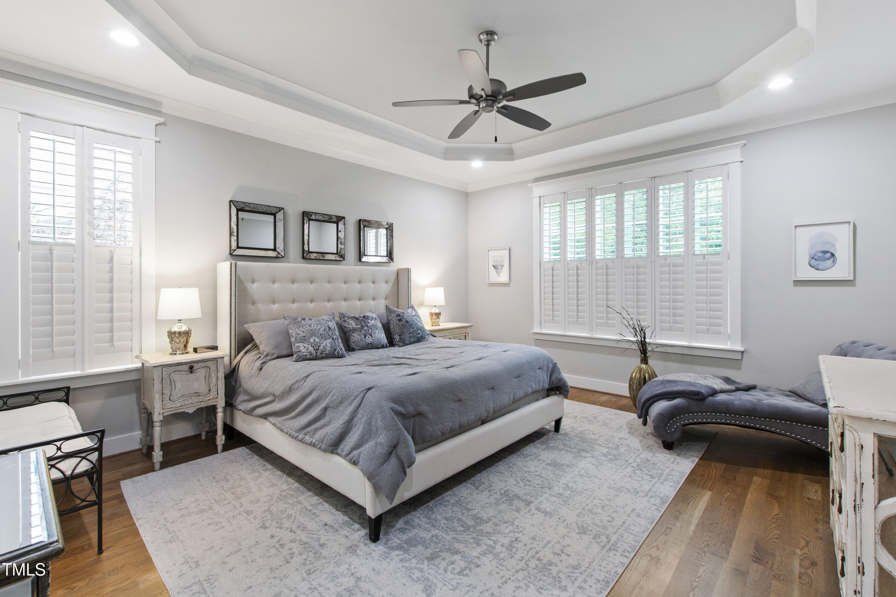 713 Brownwich Street Wake Forest, NC 27587 - Photo 26 of 78 a spacious bedroom with a bed a window and a couch