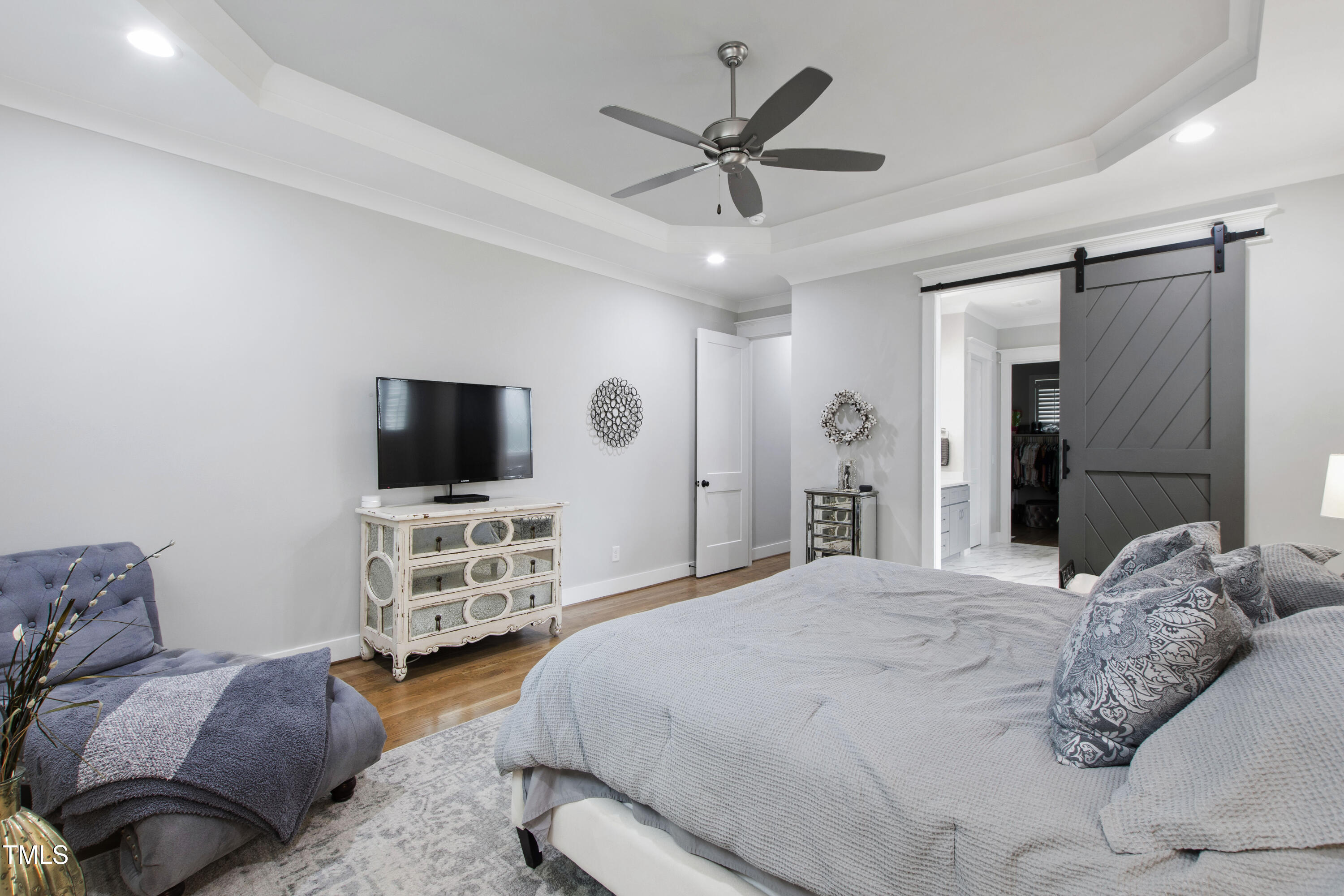 713 Brownwich Street Wake Forest, NC 27587 - Photo 27 of 78 a bedroom with a bed and a flat screen tv
