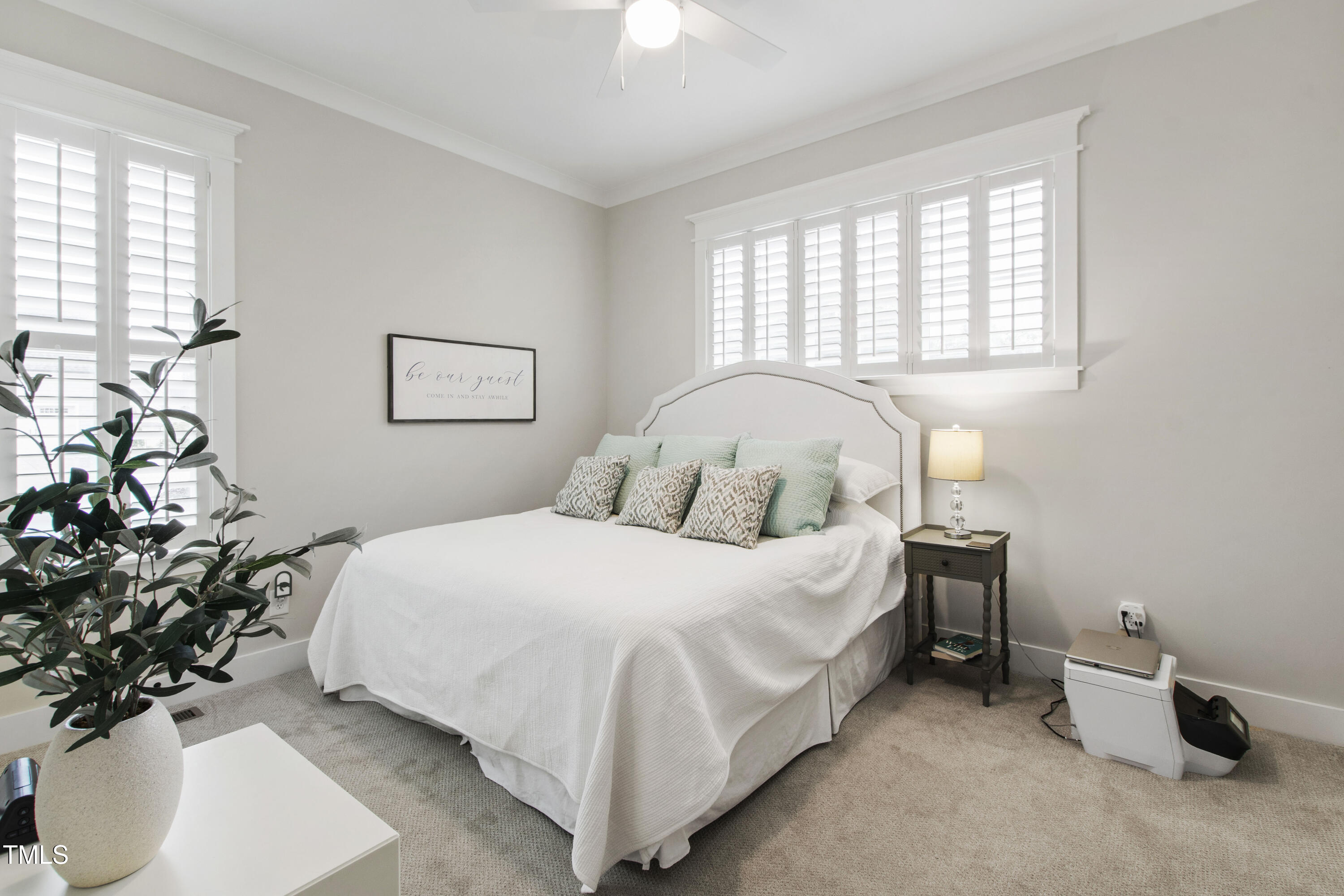 713 Brownwich Street Wake Forest, NC 27587 - Photo 34 of 78 a bedroom with a bed and a chandelier