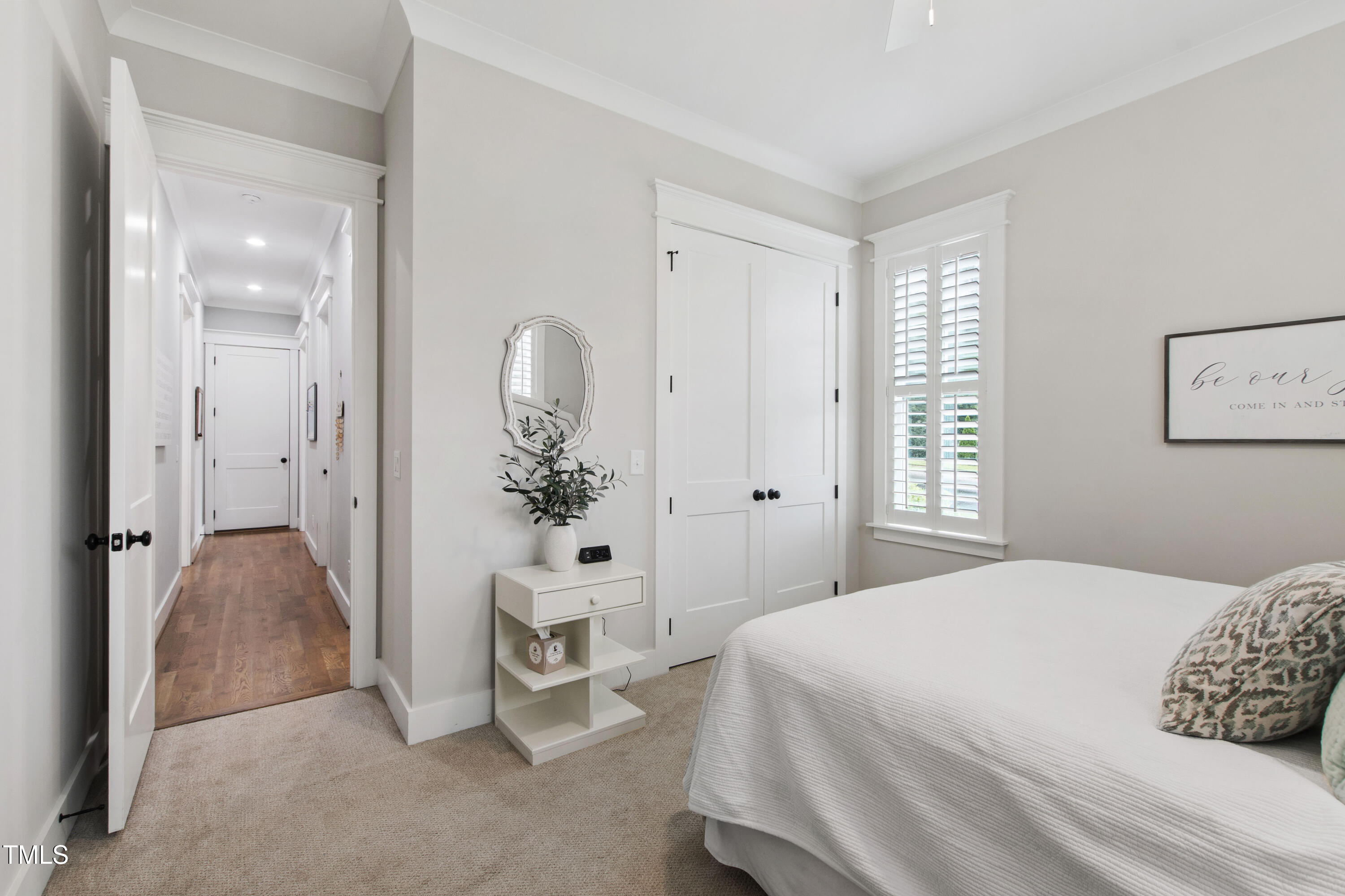 713 Brownwich Street Wake Forest, NC 27587 - Photo 35 of 78 a spacious bedroom with a bed and a potted plant