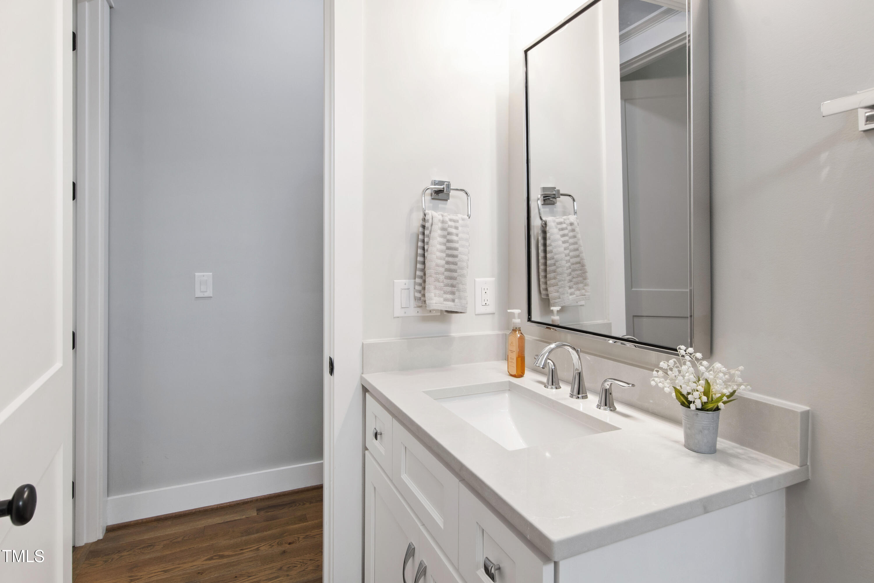713 Brownwich Street Wake Forest, NC 27587 - Photo 41 of 78 a bathroom with a sink and a mirror