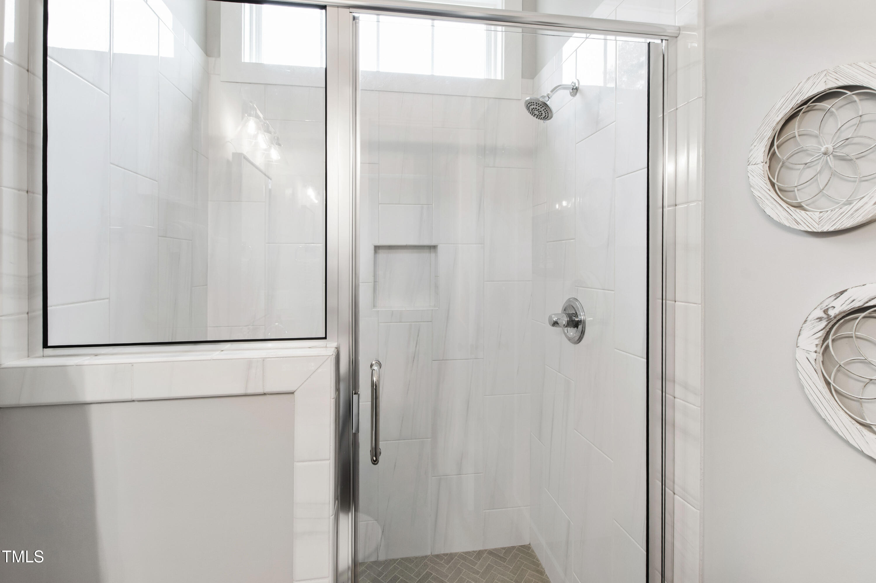 713 Brownwich Street Wake Forest, NC 27587 - Photo 42 of 78 a bathroom with a mirror a shower and a sink
