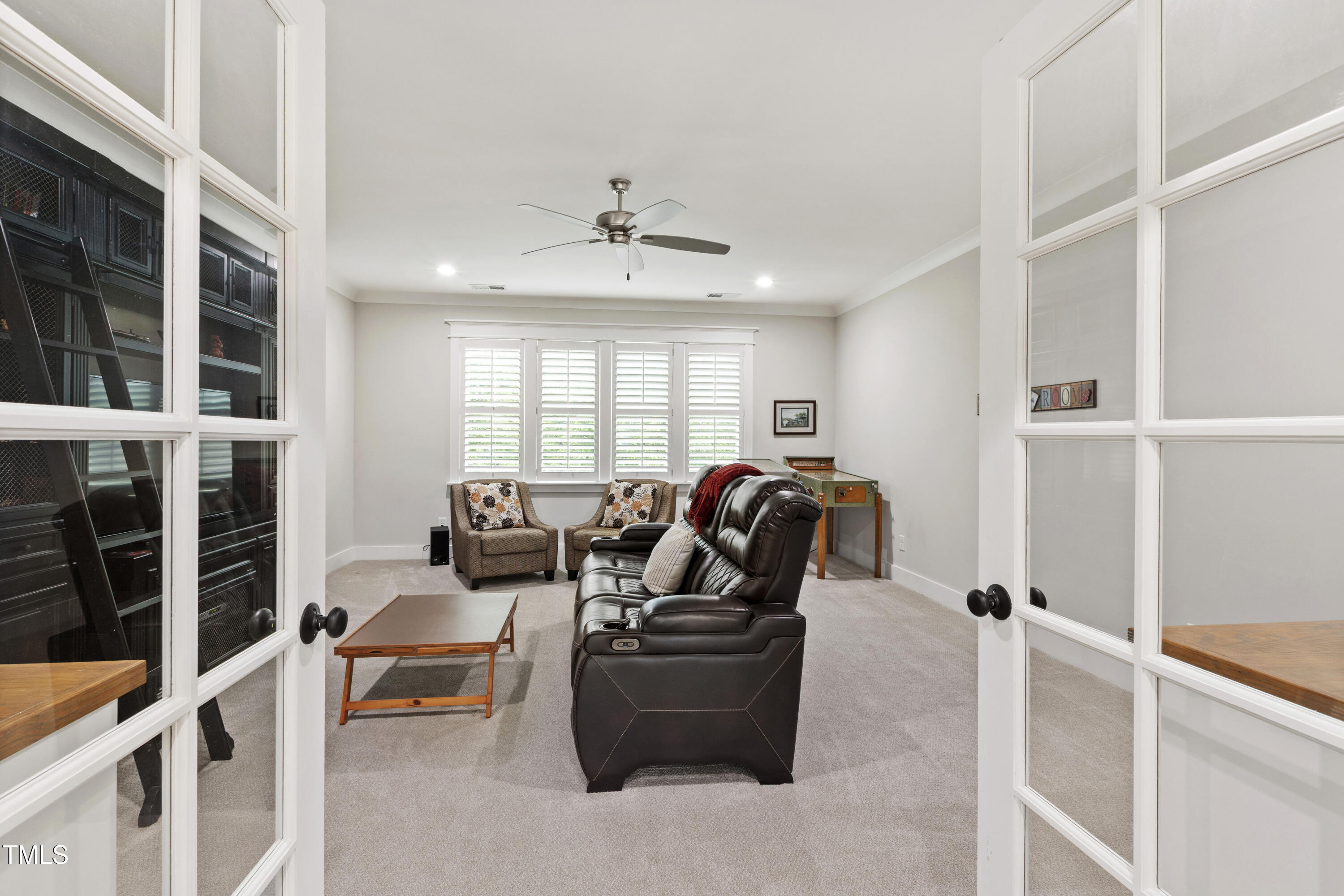 713 Brownwich Street Wake Forest, NC 27587 - Photo 43 of 78 a living room with furniture a ceiling fan and a window
