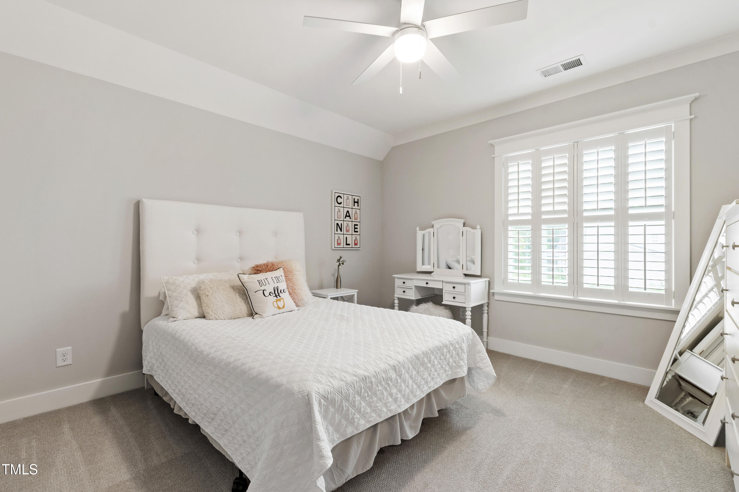713 Brownwich Street Wake Forest, NC 27587 - Photo 52 of 78 a bedroom with a bed a chandelier and a large window