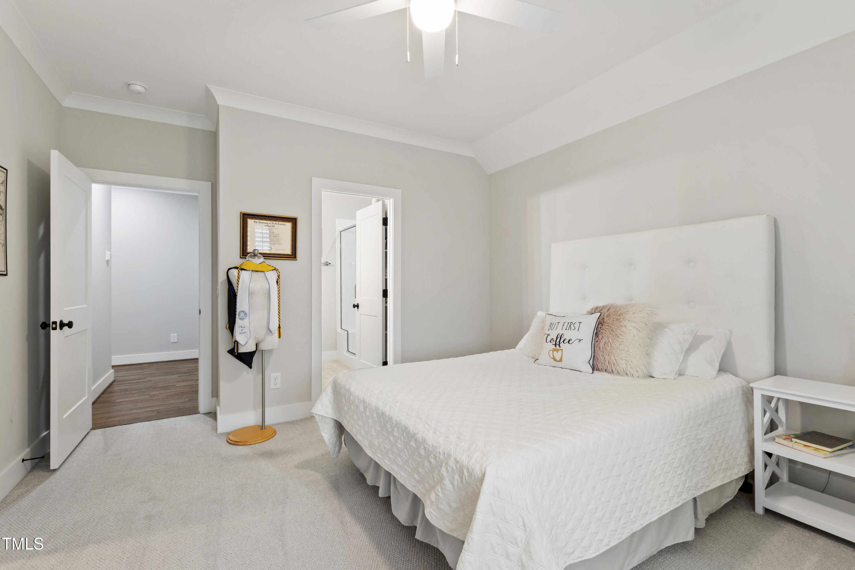 713 Brownwich Street Wake Forest, NC 27587 - Photo 53 of 78 a bedroom with a bed and a chandelier